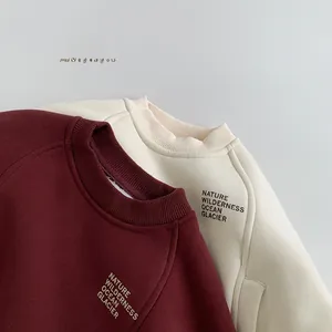 Detail of ribbed crew necklines on fleece sweatshirts in burgundy and cream white