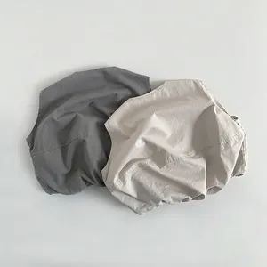 Minimalist cotton vest for kids in dark grey and off-white colors with a Japanese style