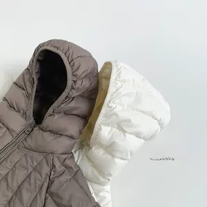 Detail of hooded down jacket with horizontal quilting and resin zipper closure