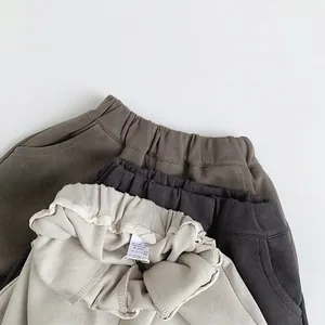 Unisex kids knitted casual sweatpants in olive green, dark grey, and off-white tones