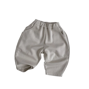 Minimalist kids knitted taupe joggers with elastic waist and side pockets for spring