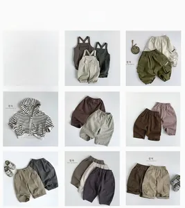 Detail showing various Korean style cotton trousers and striped hoodies for toddlers