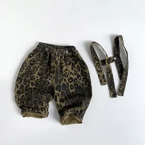 Kids leopard print overalls in olive green with elastic waist and detachable straps