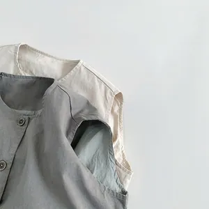 Kids minimalist cotton linen vests in grey-green and cream with round neck buttons