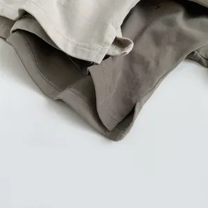 Detail of high-density cotton knit fabric and double-needle stitching on kids t-shirts