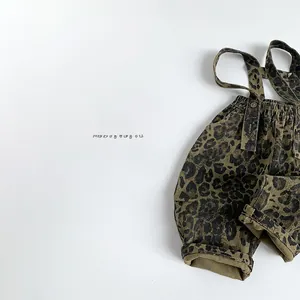Detail of kids leopard print overalls with adjustable straps and elastic waist