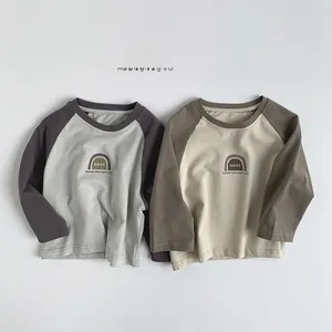 Detail of soft cotton raglan long-sleeve t-shirts with vintage graphic print for kids