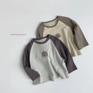 Detail of soft cotton kids long sleeve tees with raglan sleeves and letter prints