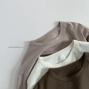 Detail view showing neat stitching on basic cotton long-sleeve T-shirts for kids