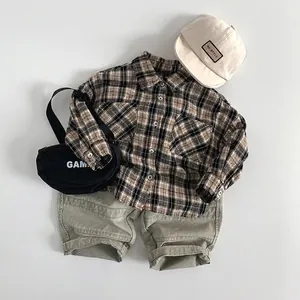 Kids yellow plaid shirt set with khaki cargo shorts and matching hat in a flat lay style