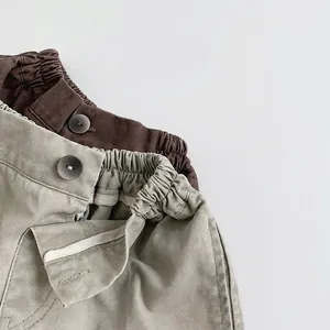 Kids vintage loose cotton pants with elastic waist and button detail in khaki and brown