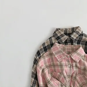 Loose-fit plaid flannel shirts for kids featuring chest pockets and classic buttons
