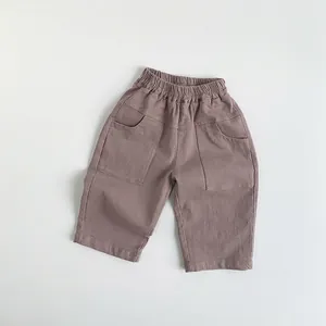 Close-up of kids casual cotton pants featuring elastic waist and large front pockets