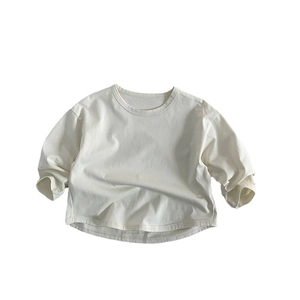 Kids minimalist long sleeve cream cotton t-shirt with loose fit and ribbed neckline