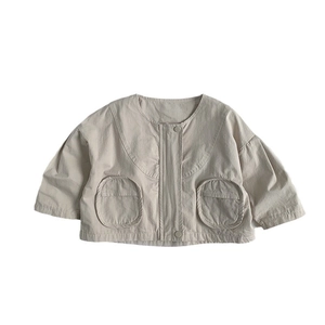 Minimalist beige cotton canvas jacket for kids featuring round neck and large pockets