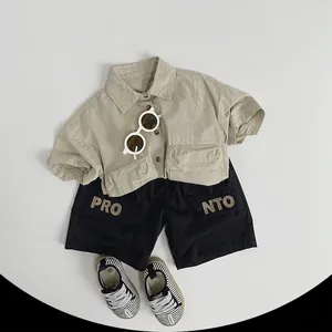 Kids casual khaki shirt and black shorts outfit set with PRONTO lettering