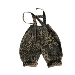 Kids leopard print overalls with adjustable brown buttons and elastic waist design
