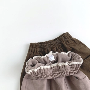 Kids casual cotton pants in brown and pink colors featuring elastic waist with ruffle details