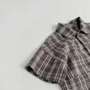 Classic checkered short sleeve baby romper with vintage brown pattern and button closure