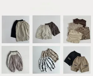 Collage of Korean style children's summer apparel featuring neutral khaki and grey outfits