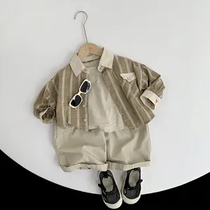 Kids cotton khaki plaid shirt and beige shorts summer outfit set with shoes and glasses