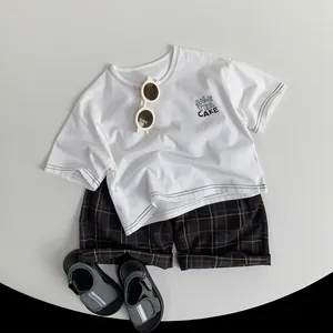 Kids unisex white graphic T-shirt and dark plaid casual shorts summer outfit set