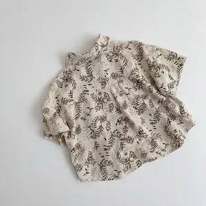 Kids short sleeve cream shirt with dark brown leaf pattern and casual lapel collar