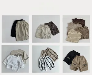 Collage of kids short-sleeve work shirts and shorts in neutral earthy tones