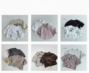 Toddler minimalist Korean style outfit collection featuring neutral cotton shirts and tees