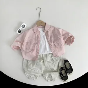 Three-piece kids summer outfit with pink cargo shirt, white tee and beige cargo pants