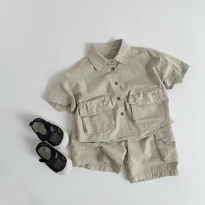 Detailed flat lay of beige kids cargo shorts and shirt set with front utility pockets