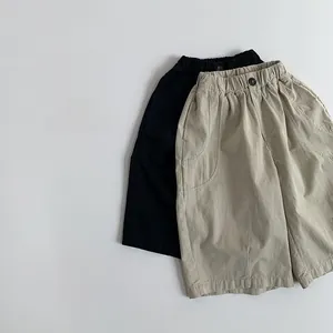 Detail view of cotton kids casual pants featuring elastic waist and large side pockets