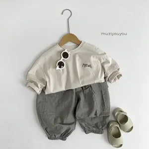 Kids long sleeve beige T-shirt and grey cargo pants set in casual Korean style