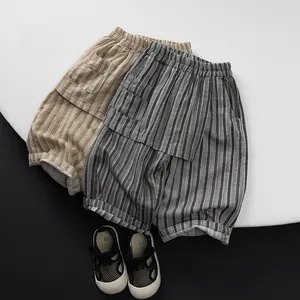 Close-up of children's breathable striped shorts with elastic waist and side pockets