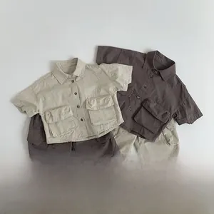Detailed view of the pure cotton fabric texture and pocket design on kids cargo shirts