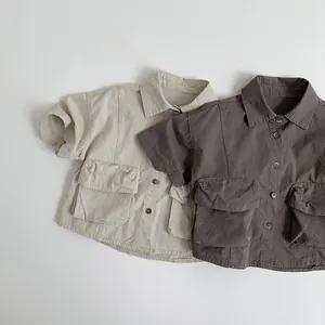 Detail view of cotton cargo shirts with button-down front and large double flap pockets