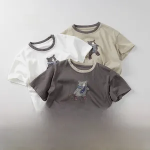 Detailed view of kids' cotton T-shirts with bear print and contrast round necklines