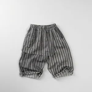 Detail view of cotton-linen gray striped children's shorts with elastic waistband and pocket
