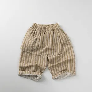 Detail view of khaki striped cotton shorts showing elastic waist and patch pocket