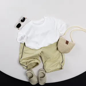 Summer kids casual cotton set with white t-shirt and light green shorts for boys and girls
