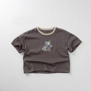 Detail of soft cotton kids t-shirt showing bear graphic and contrast ribbed neckline