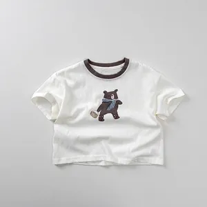 Close-up of kids white cotton tee with brown contrast collar and cartoon bear print