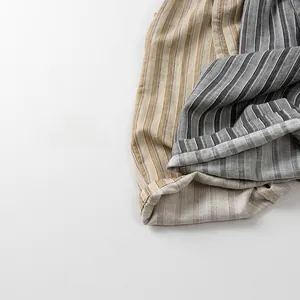 Detailed macro view of thin vertical striped cotton linen fabric for kids pants