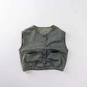 Close-up of vintage washed denim vest with four buttons and symmetrical chest pockets