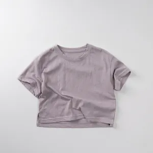 Detail of lavender cotton T-shirt featuring side slit hem and soft ribbed crew neck