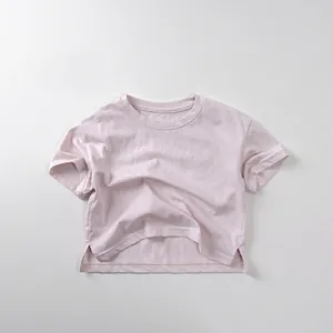Detail view of the side slit hem on a light purple cotton short sleeve T-shirt