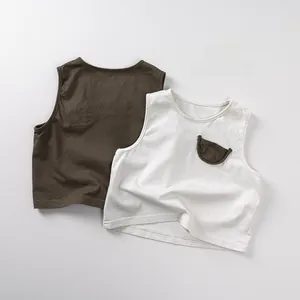 Flat lay of cotton sleeveless baby vests in olive green with print and cream with pocket