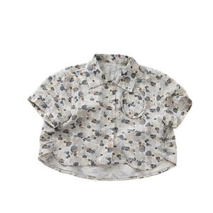 Kids short sleeve shirt with abstract pebble print and wooden buttons on beige cotton