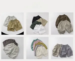 Detail view of assorted kids cotton casual shorts in various colors and pocket styles