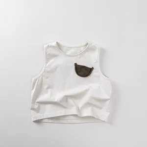 Close-up of minimalist cotton tank top featuring a brown half-moon pocket detail